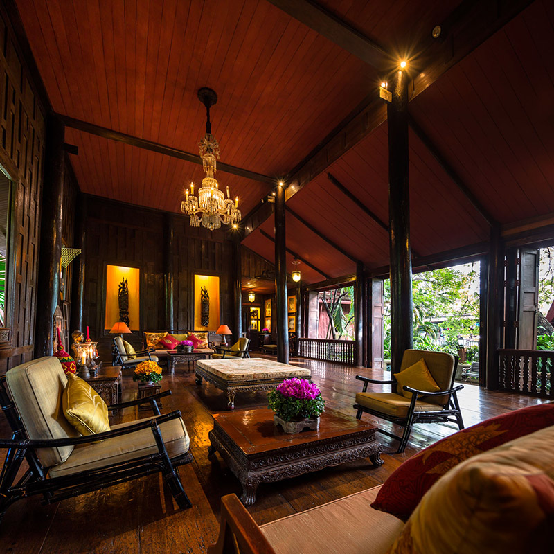 The living room with a high ceiling and a view of Maha Nak canal.